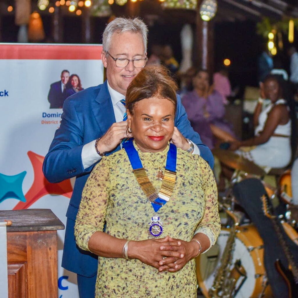 Handing over the chain of office as Rotary D7020 Governor to newly sworn in DG Dominique Bazin in Cap Hatien, Haiti, on June 30.